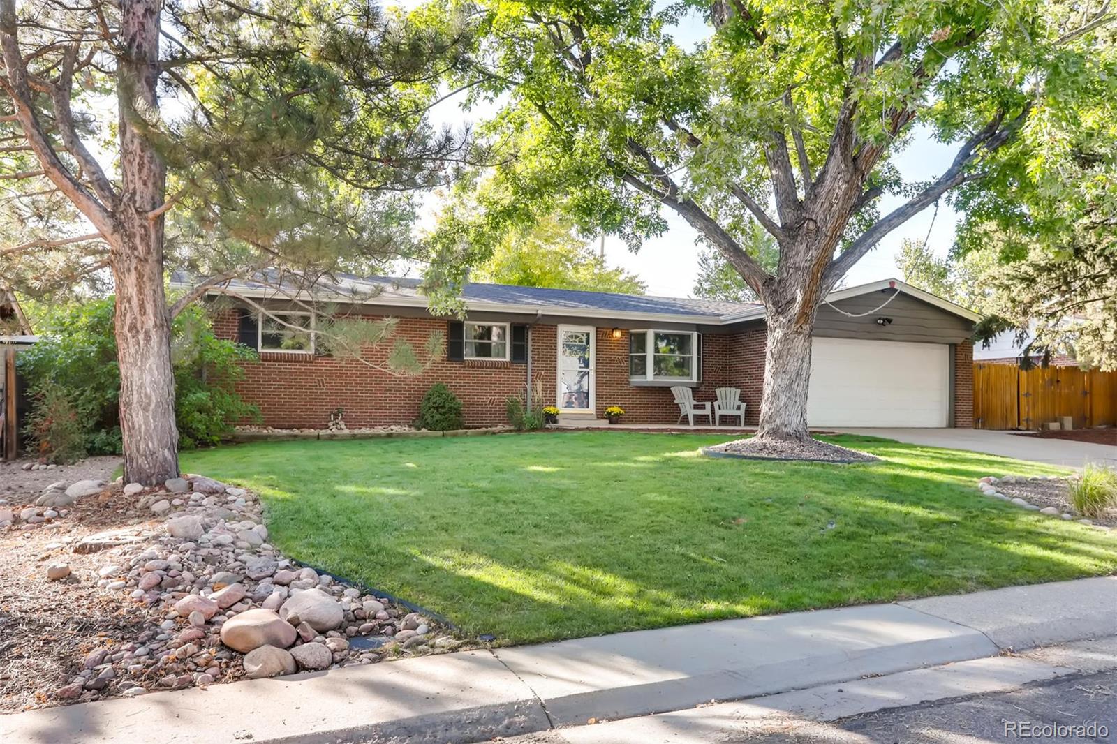 3375 Wright Street Wheat Ridge, CO 80033 - Photo 1 of 26 a view of a house with a backyard