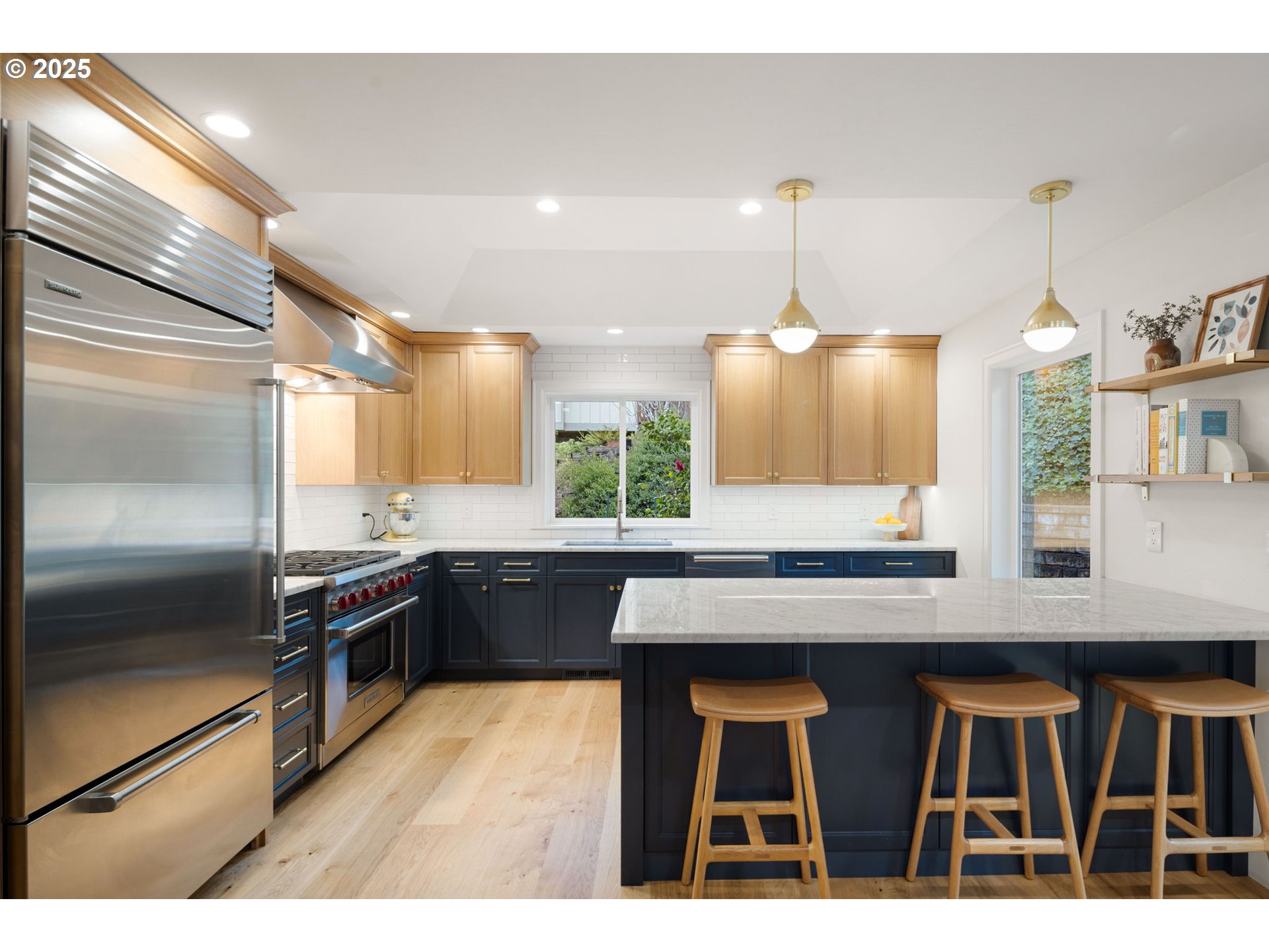 2214 West 25th Place Eugene, OR 97405 - Photo 13 of 48 a kitchen with kitchen island a counter top space appliances and cabinets