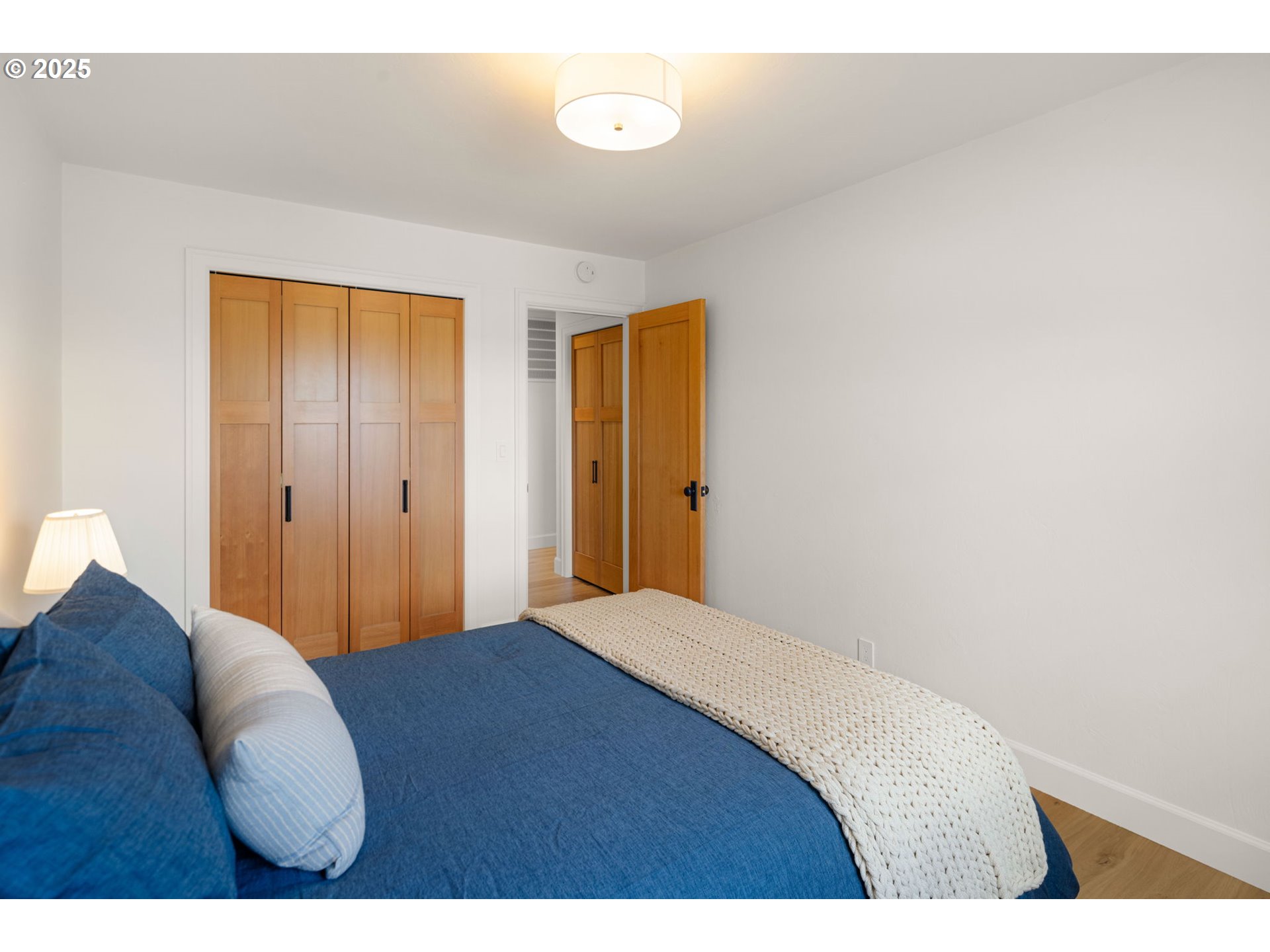 2214 West 25th Place Eugene, OR 97405 - Photo 38 of 48 a bedroom with a bed and a table