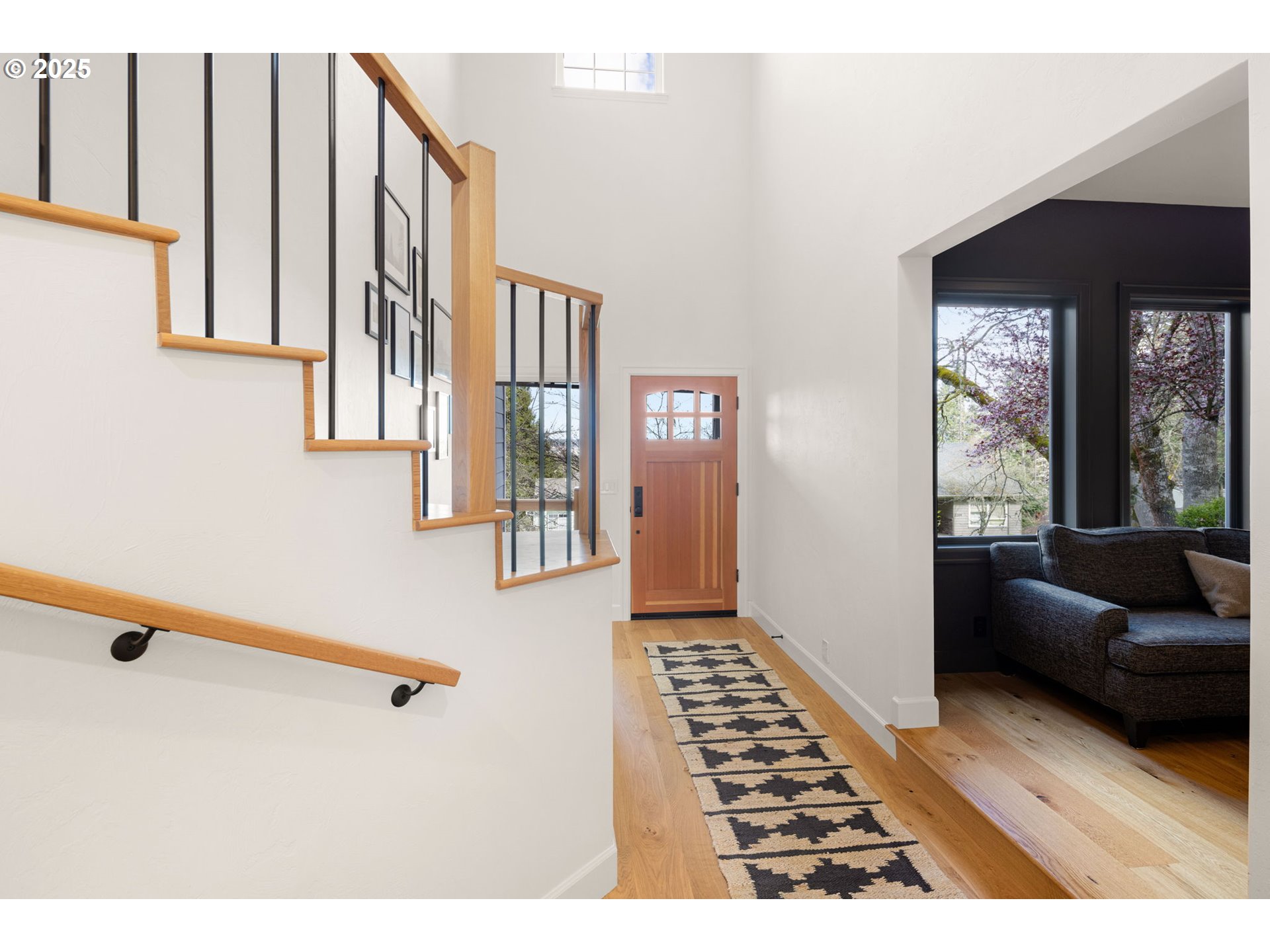 2214 West 25th Place Eugene, OR 97405 - Photo 5 of 48 a living room with furniture and a floor to ceiling window