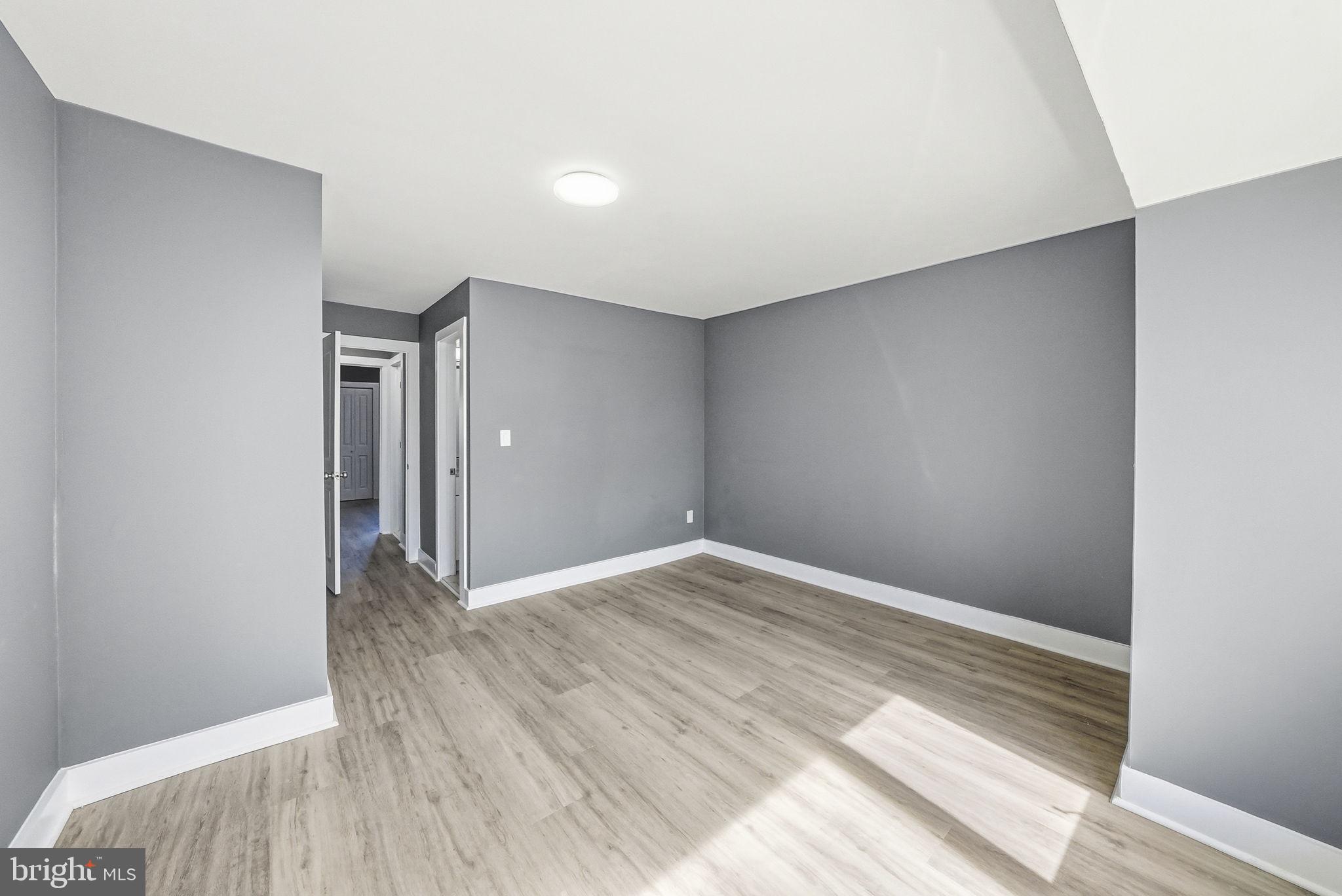 371 Bolton Road East Windsor, NJ 08520 - Photo 10 of 20 a view of an empty room with wooden floor