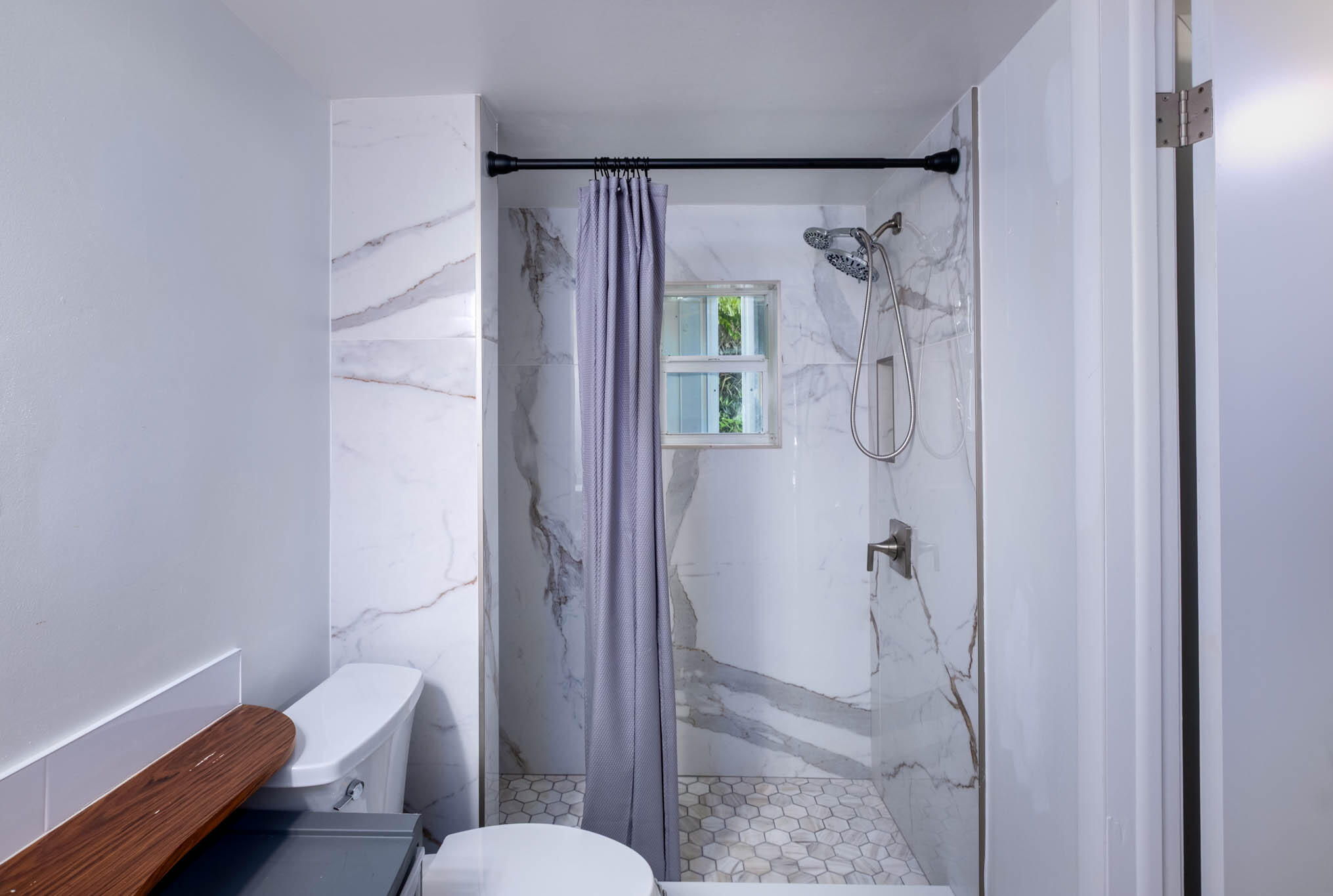 153 Apache Street Tavernier, FL 33070 - Photo 17 of 20 a bathroom with a shower and a toilet