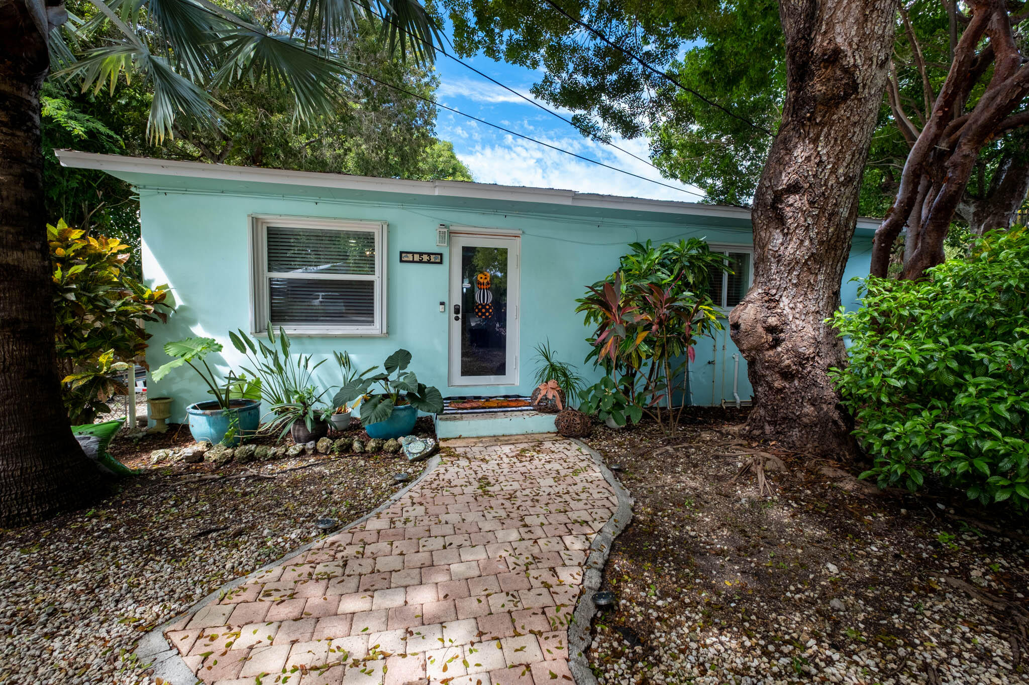 153 Apache Street Tavernier, FL 33070 - Photo 20 of 20 a front view of a house with a yard