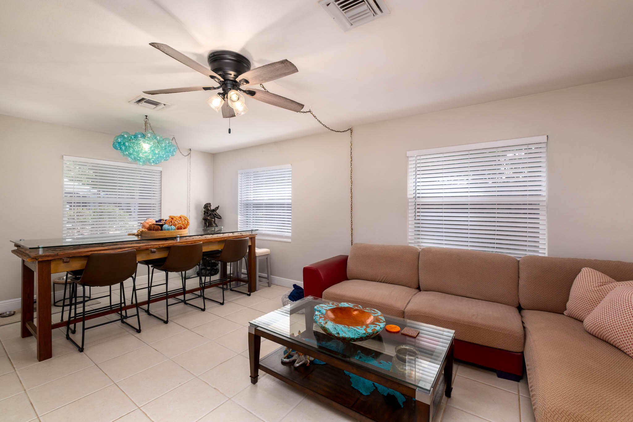 153 Apache Street Tavernier, FL 33070 - Photo 5 of 20 a living room with furniture and a large window