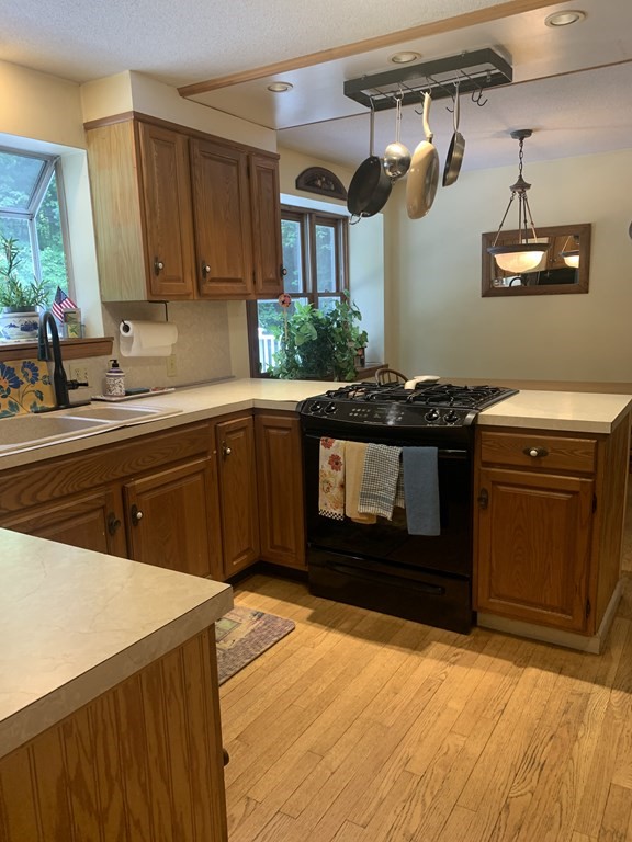33 North Monson Road Hampden, MA 01036 - Photo 5 of 9 a kitchen with a stove and a sink