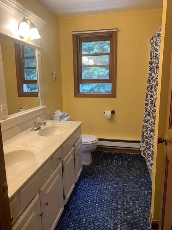 33 North Monson Road Hampden, MA 01036 - Photo 9 of 9 a bathroom with a sink a toilet and shower