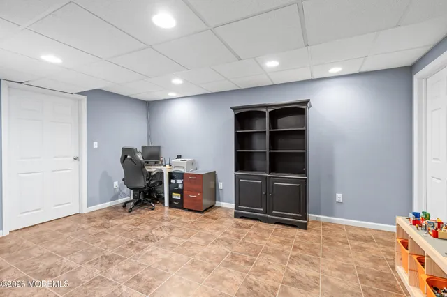 a bed room with a bed and a chair