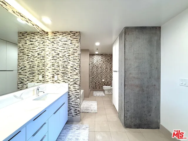 a bathroom with a bathtub and a sink