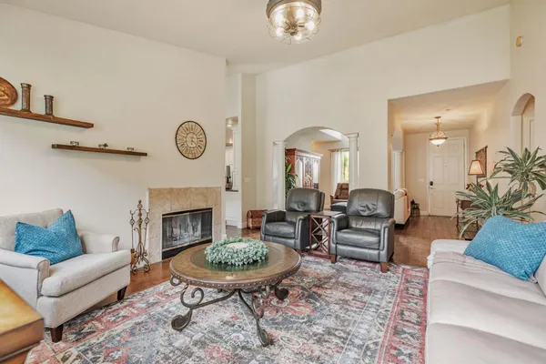 a kitchen that has a lot of cabinets a sink and wooden floor