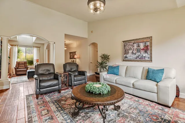 a kitchen with sink stove and refrigerator