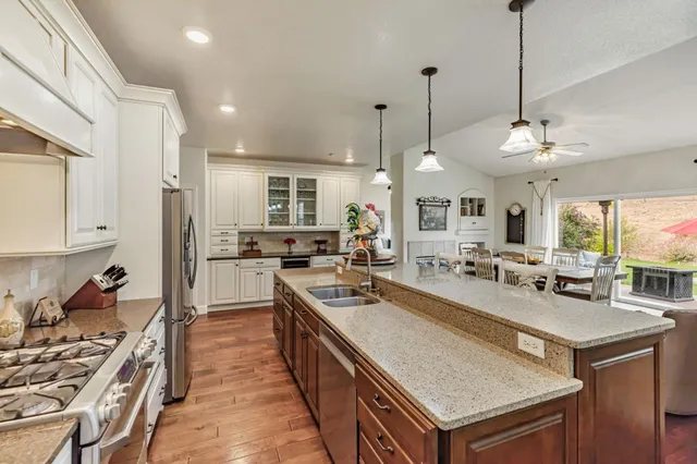 a kitchen with a sink and a refrigerator