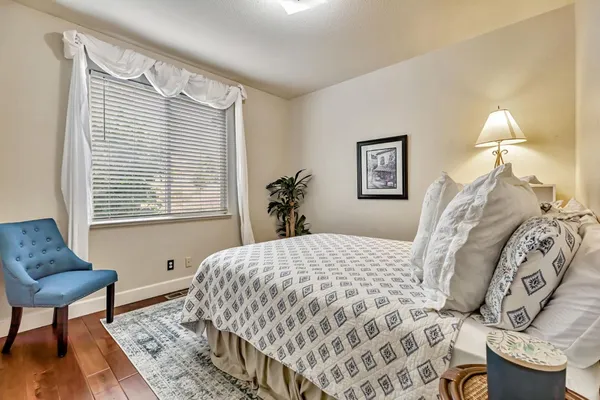 a bedroom with a bed and a table in it