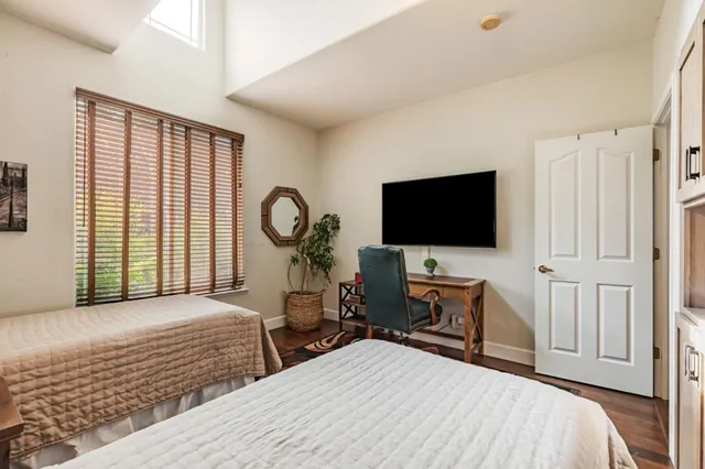 a bedroom with a bed and a couch