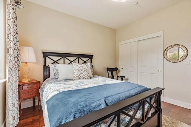a view of a room with wooden floor