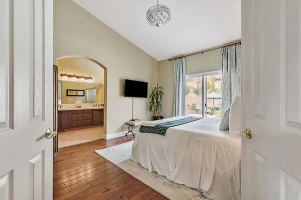 a bathroom with a double vanity sink mirror and shower