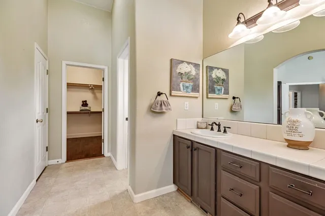 an aerial view of a house with garden space and street view