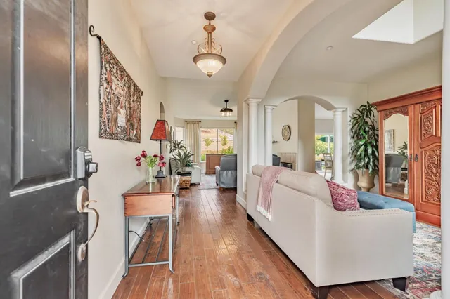 a bedroom with a bed a couch and a window