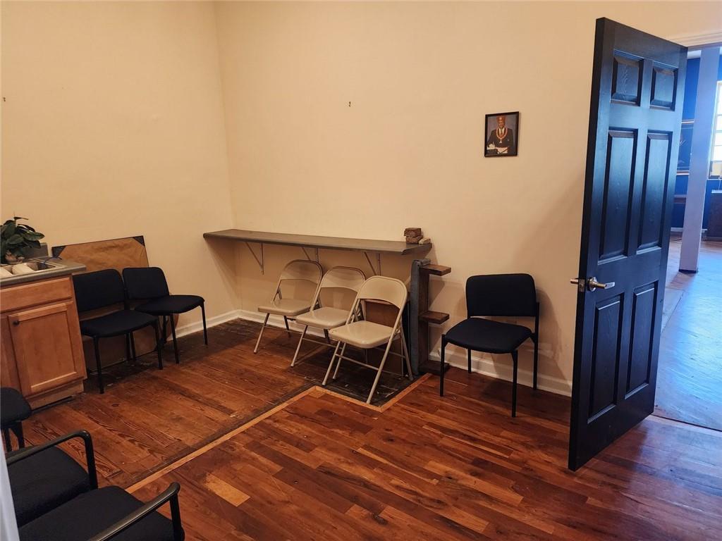 6958 Main Street Lithonia, GA 30058 - Photo 44 of 55 a balcony with chairs and wooden floor