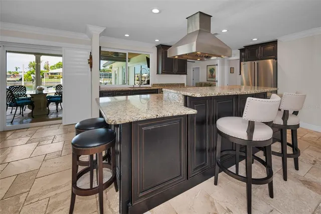 a bedroom with two beds and a chandelier