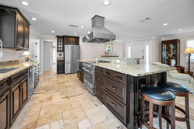 a bathroom with double vanity sinks and a mirror
