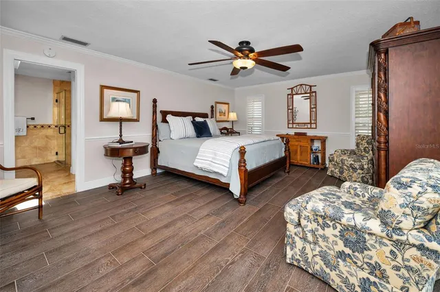 a bathroom with a granite countertop sink a mirror and shower