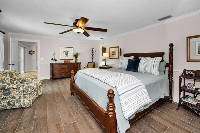 a living room with furniture and a view of kitchen