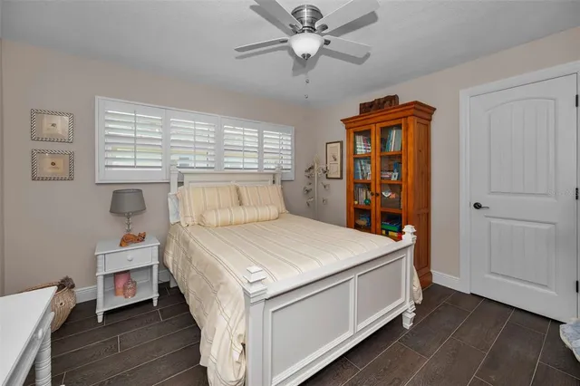 a bathroom with a granite countertop sink mirror and shower