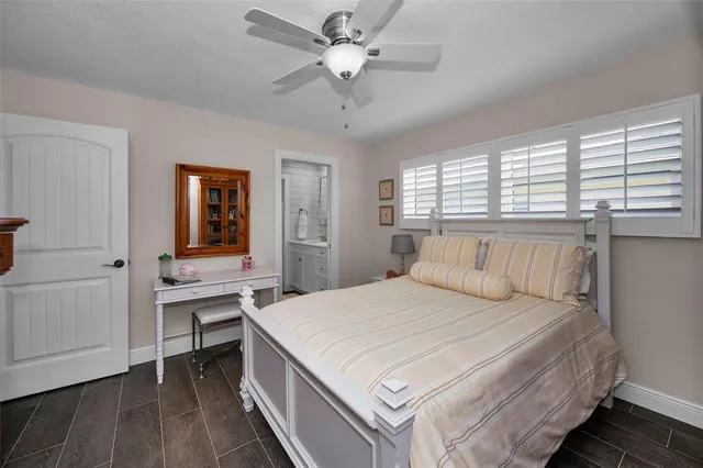 a view of a livingroom with furniture and a bookshelf