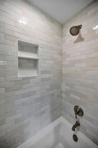 a kitchen with a refrigerator and cabinets