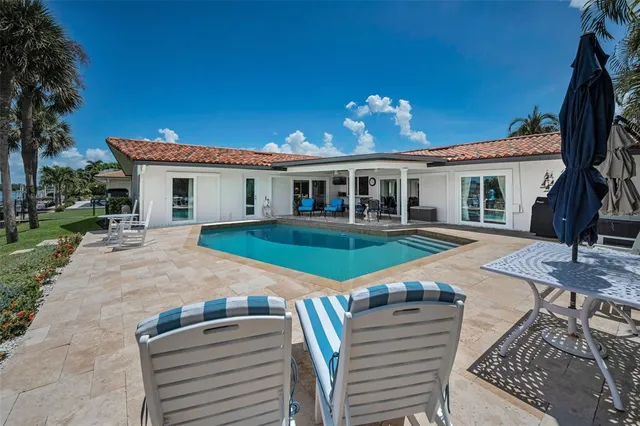 a view of a lake with boats and trees