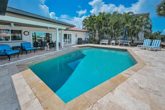 a view of a backyard with palm trees