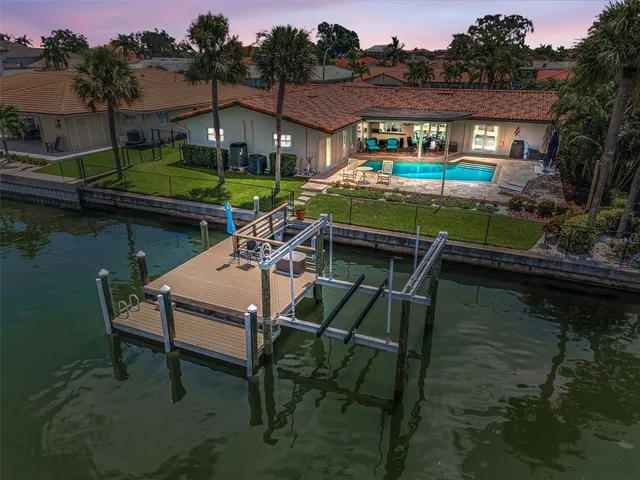 an aerial view of a house with a lake view