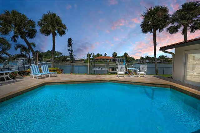an aerial view of a house with a lake view