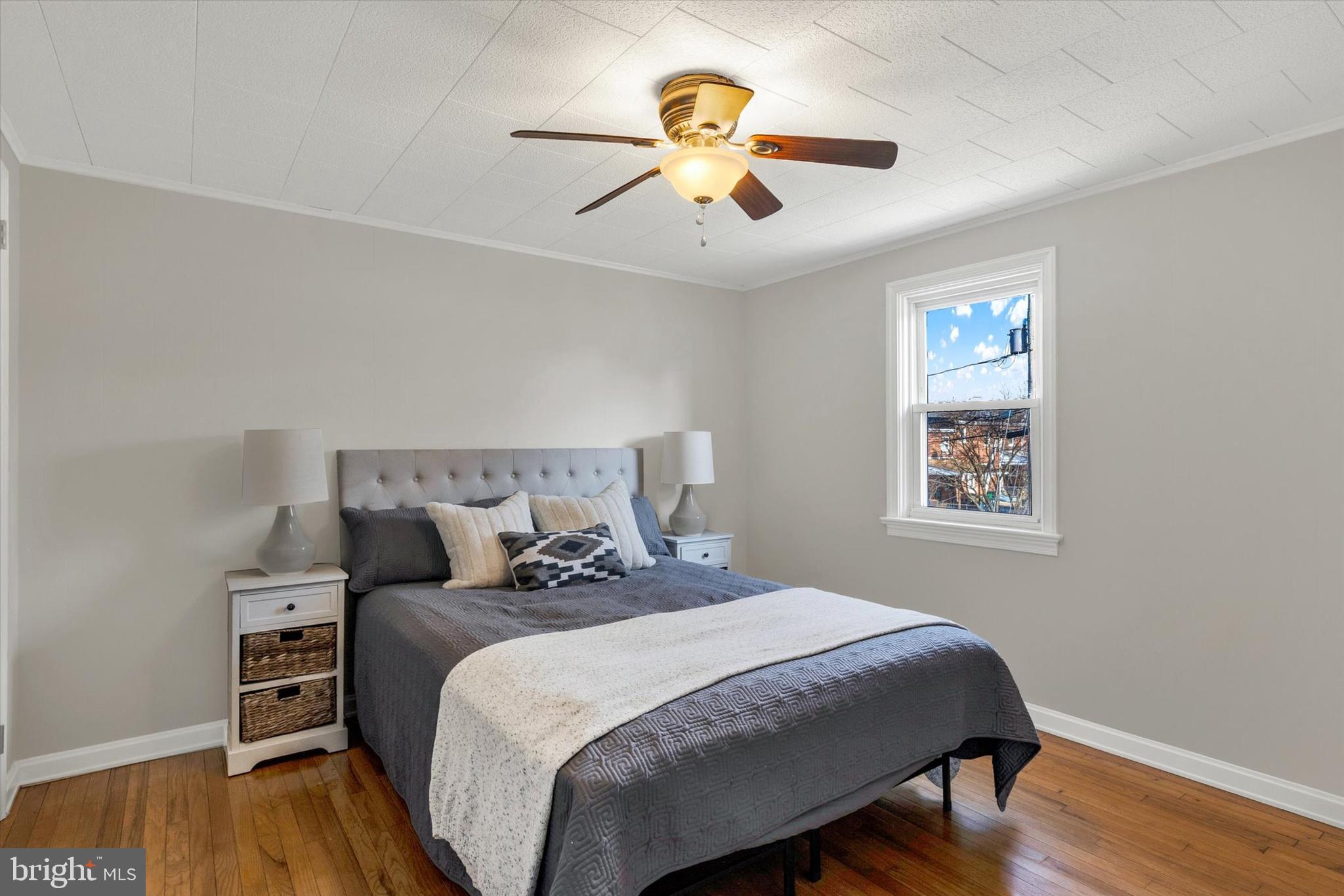 1218 Fremont Street Lancaster, PA 17603 - Photo 11 of 24 a bedroom with a bed and wooden floor