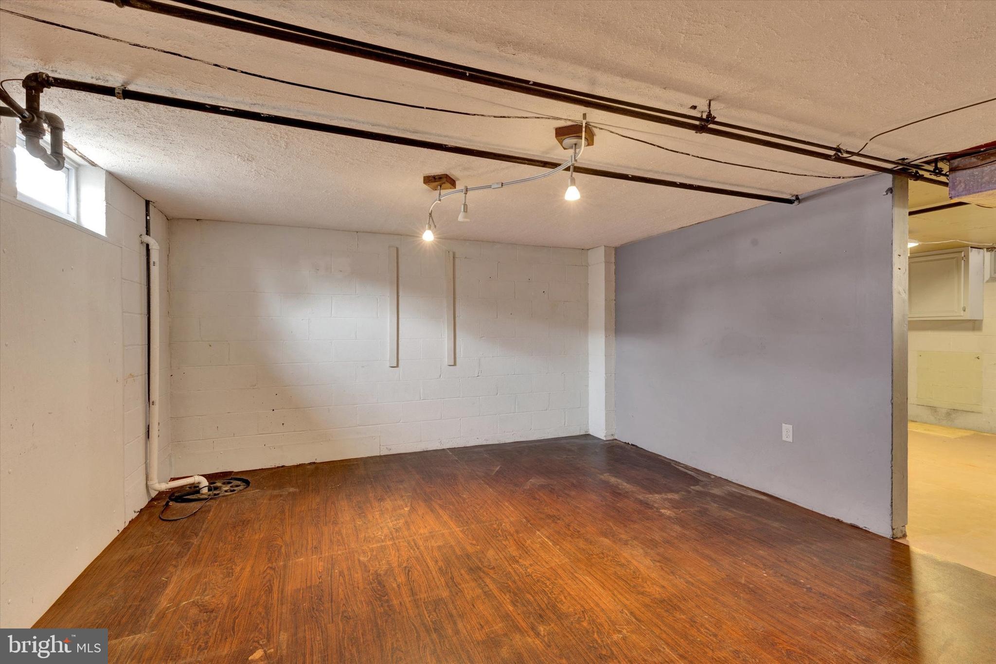 1218 Fremont Street Lancaster, PA 17603 - Photo 20 of 24 a view of a room with wooden floor and window