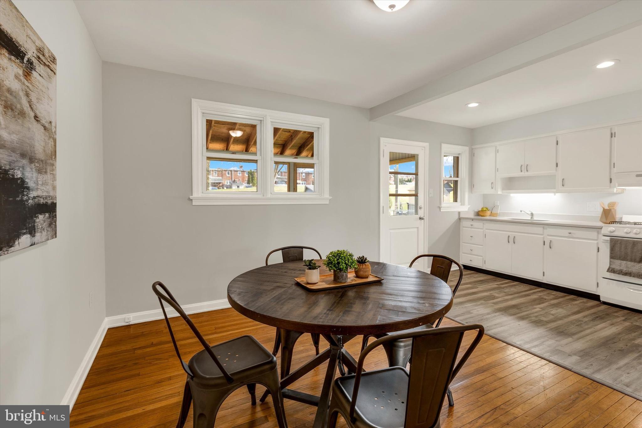 1218 Fremont Street Lancaster, PA 17603 - Photo 7 of 24 a kitchen with a dining table and chairs