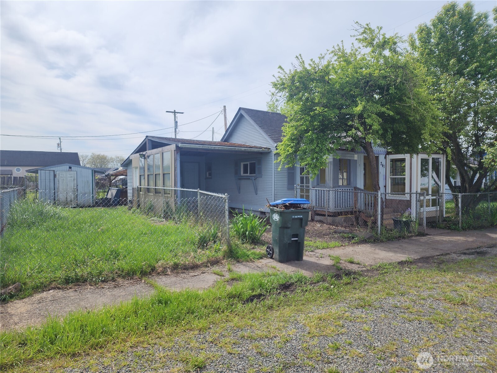 241 Southwest 10th Street Chehalis, WA 98532 - Photo 3 of 16 a view of a house with a yard and sitting area