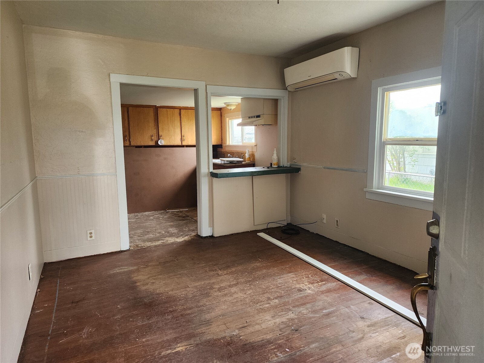 241 Southwest 10th Street Chehalis, WA 98532 - Photo 6 of 16 a view of an empty room with kitchen and a window