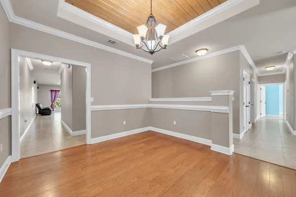 a kitchen with stainless steel appliances granite countertop a refrigerator a stove top oven a sink and dishwasher