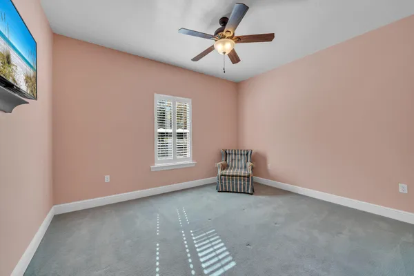 a kitchen with kitchen island granite countertop a sink cabinets stainless steel appliances and a counter top space