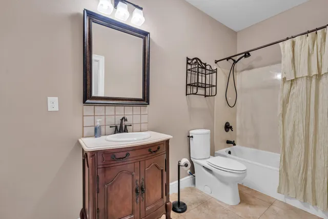 a view of kitchen with furniture ceiling fan and windows