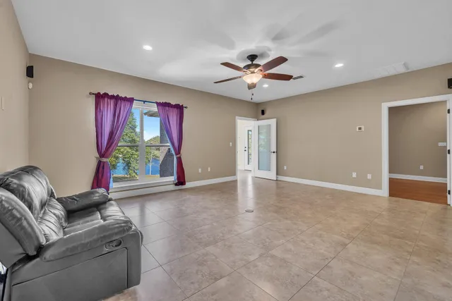 a view of an empty room with a window