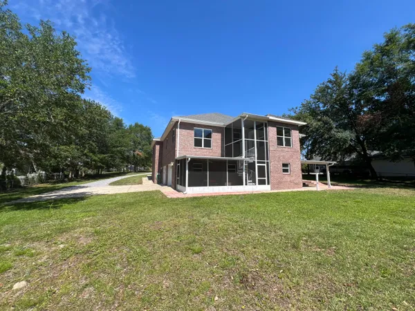 a view of a house with a big yard