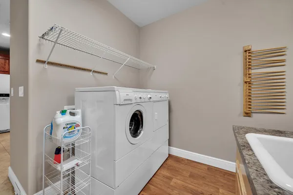 a view of walk in closet with empty racks