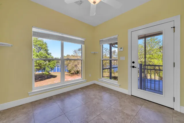 a view of a livingroom with furniture and a ceiling fan