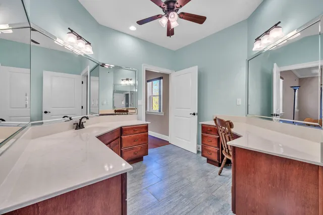 a view of an empty room with a fireplace and a large window