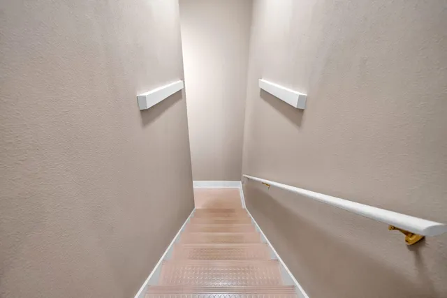 a view of a field with trees in the background