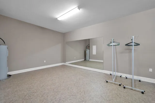 a house view with swimming pool in front of it