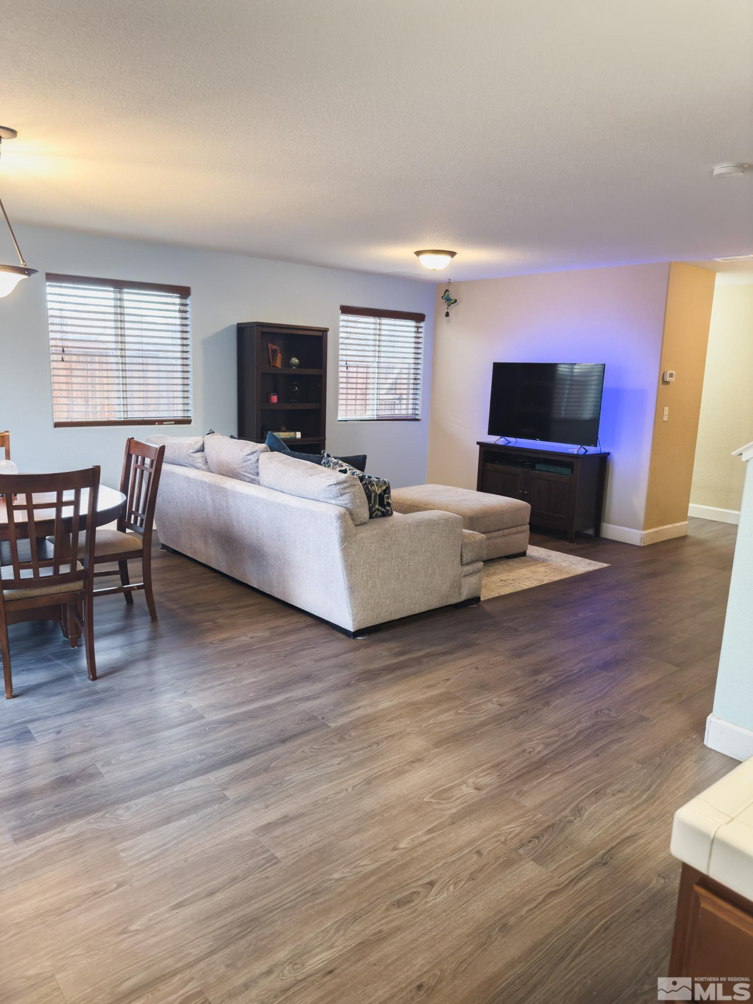 11630 Verazae Drive Reno, NV 89521 - Photo 3 of 16 a living room with furniture and a flat screen tv