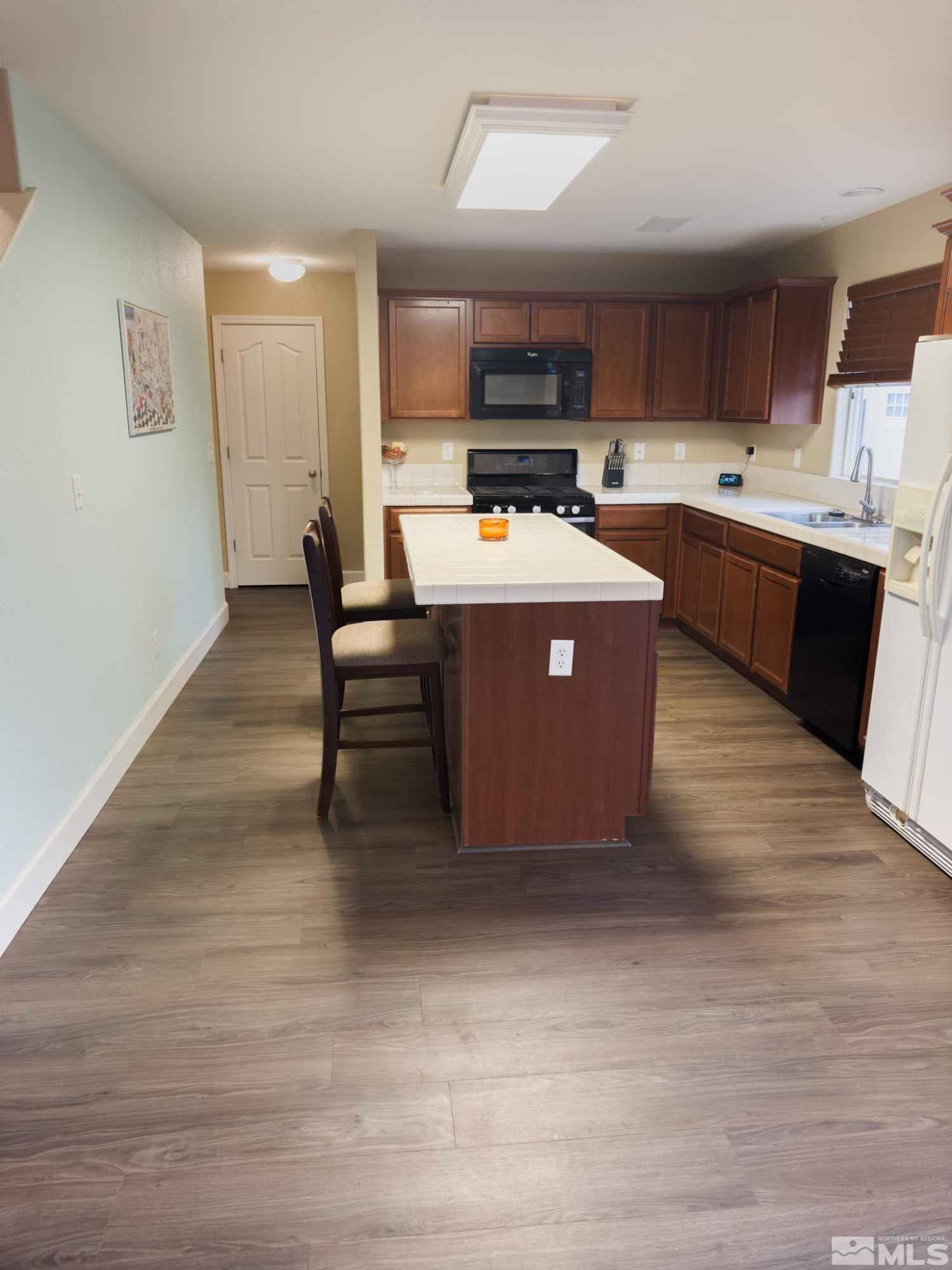 11630 Verazae Drive Reno, NV 89521 - Photo 4 of 16 a kitchen with a cabinets a counter space and stainless steel appliances